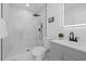 Bathroom with glass-enclosed shower with black hardware and gray vanity with modern faucet at 5405 59Th N St, St Petersburg, FL 33709