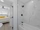 Modern bathroom with a glass-enclosed shower, and view to bedroom at 5405 59Th N St, St Petersburg, FL 33709