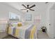 Comfortable bedroom featuring natural light, a decorative pillow, and fresh flowers at 5405 59Th N St, St Petersburg, FL 33709