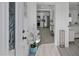 Bright foyer with view of the modern kitchen with stainless steel appliances and a bedroom in the distance at 5405 59Th N St, St Petersburg, FL 33709