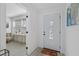 Bright foyer with a view to a room with a window, next to the main door at 5405 59Th N St, St Petersburg, FL 33709
