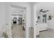 Bright foyer with view of the modern kitchen with stainless steel appliances and a bedroom in the distance at 5405 59Th N St, St Petersburg, FL 33709