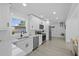 Bright kitchen featuring modern stainless steel appliances, white cabinets, and recessed lighting at 5405 59Th N St, St Petersburg, FL 33709