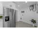 Kitchen area with stainless steel refrigerator and modern appliances and fixtures at 5405 59Th N St, St Petersburg, FL 33709