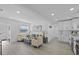 Open-concept living room showcasing natural light, recessed lighting, and sleek flooring at 5405 59Th N St, St Petersburg, FL 33709