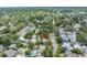 An aerial view of the property in a neighborhood setting with mature trees and landscaping at 546 26Th N Ave, St Petersburg, FL 33704