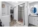 Bathroom view with walk-in closet access, a glass shower stall, and a sink vanity at 546 26Th N Ave, St Petersburg, FL 33704