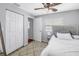 Well-lit bedroom featuring a large window, plush rug, and a glimpse into an ensuite bathroom at 546 26Th N Ave, St Petersburg, FL 33704