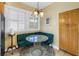 Bright breakfast nook with a cushioned bench and glass table at 546 26Th N Ave, St Petersburg, FL 33704