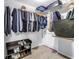 Walk-in closet with plenty of clothes, storage racks, and shoe organizer at 546 26Th N Ave, St Petersburg, FL 33704