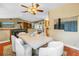 Dining area with hardwood floors, a modern light fixture, and white chairs at 546 26Th N Ave, St Petersburg, FL 33704