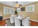 Dining room featuring hardwood floors, a ceiling fan, and natural light at 546 26Th N Ave, St Petersburg, FL 33704