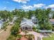 Beautifully landscaped home featuring a brick driveway and porch with lush trees and private pool at 546 26Th N Ave, St Petersburg, FL 33704