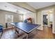 Spacious game room with ping pong table, tile floors, and natural light from the window at 546 26Th N Ave, St Petersburg, FL 33704
