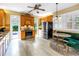 Bright kitchen with modern appliances, custom cabinets, a dining area, and seamless access to the outdoor area at 546 26Th N Ave, St Petersburg, FL 33704
