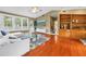 Cozy living room with wood floors, large windows, and built-in shelving at 546 26Th N Ave, St Petersburg, FL 33704