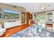 Bright living room with wood floors, a TV, and sliding glass doors at 546 26Th N Ave, St Petersburg, FL 33704