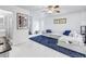Bright, open living room with white tile floors, modern furnishings, and a unique stained glass window at 546 26Th N Ave, St Petersburg, FL 33704