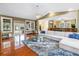 Open living room with a sectional sofa, wood floors, and pool access at 546 26Th N Ave, St Petersburg, FL 33704