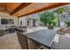 Relaxing outdoor living area featuring a covered patio, comfortable seating, and a refreshing pool for entertaining and leisure at 546 26Th N Ave, St Petersburg, FL 33704