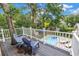 Balcony overlooking a private backyard pool with lounge chairs at 546 26Th N Ave, St Petersburg, FL 33704