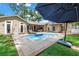 Beautiful backyard pool with lounge chairs, umbrella, and spacious patio area perfect for outdoor enjoyment at 546 26Th N Ave, St Petersburg, FL 33704