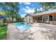 Inviting pool and patio area surrounded by lush landscaping, perfect for relaxing and entertaining outdoors at 546 26Th N Ave, St Petersburg, FL 33704