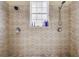 Clean bathroom shower featuring tile, window, and dual shower heads at 546 26Th N Ave, St Petersburg, FL 33704