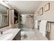 Bathroom features a shower and bath combo and a dark vanity at 5729 Calais N Blvd # 6, St Petersburg, FL 33714
