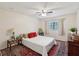 Bedroom features a ceiling fan, area rug, and bright window at 5729 Calais N Blvd # 6, St Petersburg, FL 33714