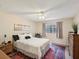 Cozy bedroom with area rug, soft lighting, and neutral wall color at 5729 Calais N Blvd # 6, St Petersburg, FL 33714