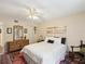 Comfortable bedroom featuring a dresser, plush carpet, and soft lighting at 5729 Calais N Blvd # 6, St Petersburg, FL 33714