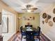 Dining room with a round table, decorative rug, and nearby kitchen access at 5729 Calais N Blvd # 6, St Petersburg, FL 33714