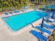 Bright, clean pool with lounge chairs for residents on a sunny day at 5729 Calais N Blvd # 6, St Petersburg, FL 33714