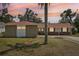 Charming single story home featuring stone accents, a red roof, and a spacious driveway at 6408 Olympia Ave, Tampa, FL 33634