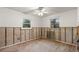 Bright bedroom with natural light from windows and concrete walls, awaiting renovation at 701 59Th Ne Ave, St Petersburg, FL 33703