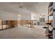 Large, unfinished living area with concrete floors and partial walls, ready for renovation at 701 59Th Ne Ave, St Petersburg, FL 33703