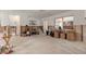 Unfinished living area with concrete floors, partial walls, a window, and space for customization at 701 59Th Ne Ave, St Petersburg, FL 33703