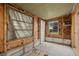 Unfinished living room features natural light, wood flooring, and stud walls ready for renovation at 701 59Th Ne Ave, St Petersburg, FL 33703