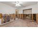 Spacious living space features wood-look flooring, and stud walls ready for renovation at 701 59Th Ne Ave, St Petersburg, FL 33703