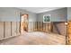 Well-lit living space featuring wood-look flooring, neutral walls, and awaiting renovation at 701 59Th Ne Ave, St Petersburg, FL 33703