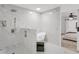 Stunning primary bath features a spacious shower with white marble-style tile, and a soaking tub at 7032 Pelican Island Dr, Tampa, FL 33634