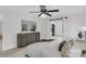 Bedroom featuring hard surface flooring, a ceiling fan, and a decorative chest of drawers at 7032 Pelican Island Dr, Tampa, FL 33634