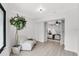 Bonus room featuring hard surface flooring and open doorway to a bedroom at 7032 Pelican Island Dr, Tampa, FL 33634