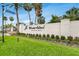 Elegant community entrance sign with lush landscaping, creating a welcoming and prestigious atmosphere at 7032 Pelican Island Dr, Tampa, FL 33634