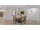 Bright dining area features a marble table, stylish chairs and updated light fixture at 7032 Pelican Island Dr, Tampa, FL 33634