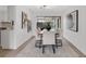 Elegant dining room with modern lighting and sliding doors to the outside at 7032 Pelican Island Dr, Tampa, FL 33634