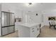 Bright kitchen with stainless steel refrigerator and center island at 7032 Pelican Island Dr, Tampa, FL 33634
