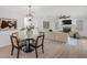 This open-concept living room and dining area features lots of natural light at 7032 Pelican Island Dr, Tampa, FL 33634