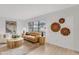 Cozy living room features stylish decor, a large window, and wood floors that make for comfortable living at 7032 Pelican Island Dr, Tampa, FL 33634